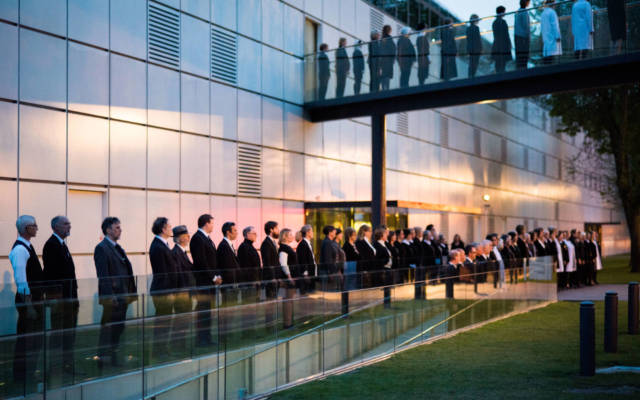 Photo from NNF15 show The Observatory, a long single-file line of people runs down past the Sainsbury Centre for Visual Arts.