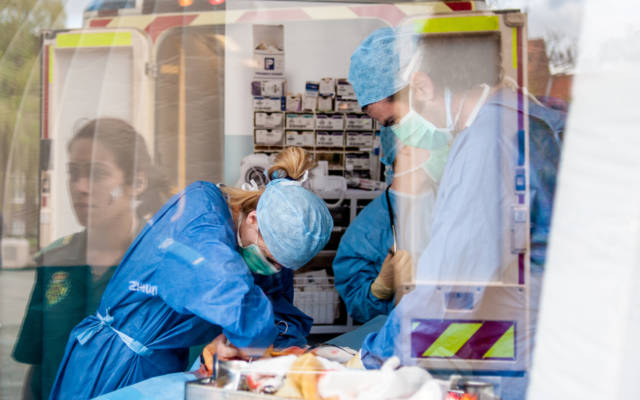 Photo from NNF13 show The Kindness of Strangers, people performing surgery.