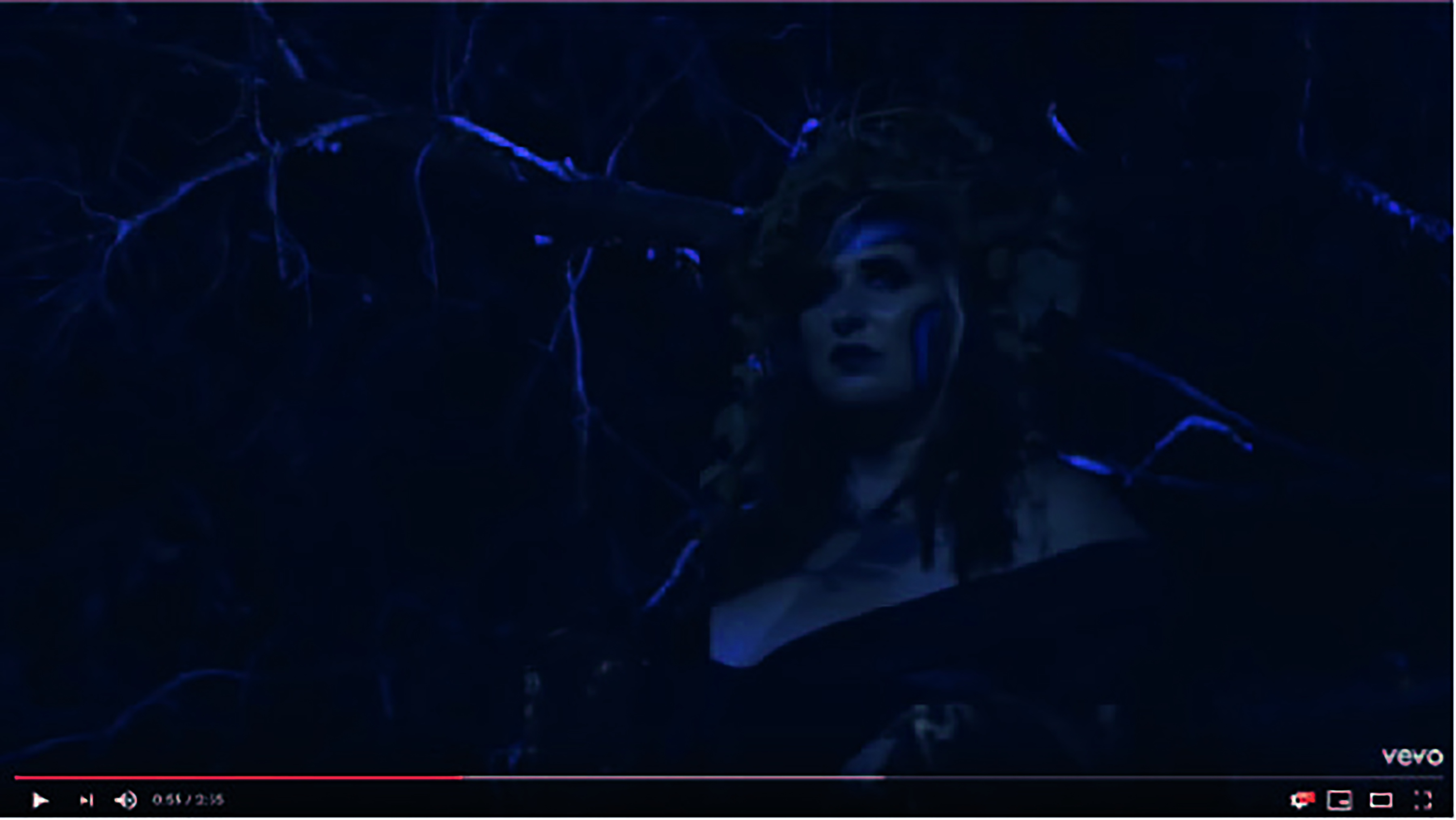 Video Thumbnail: Sarah dressed in elaborate face paint walking through a moonlighted forest