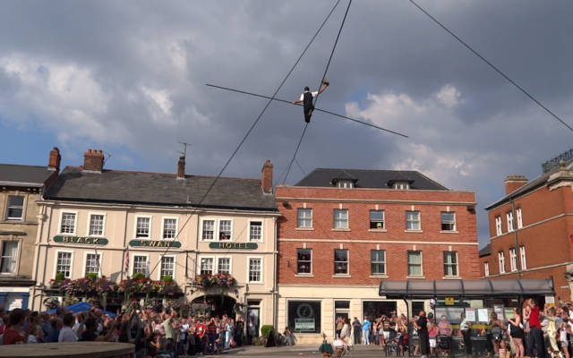 Chris Bullzini tight-rope walks across a town centre