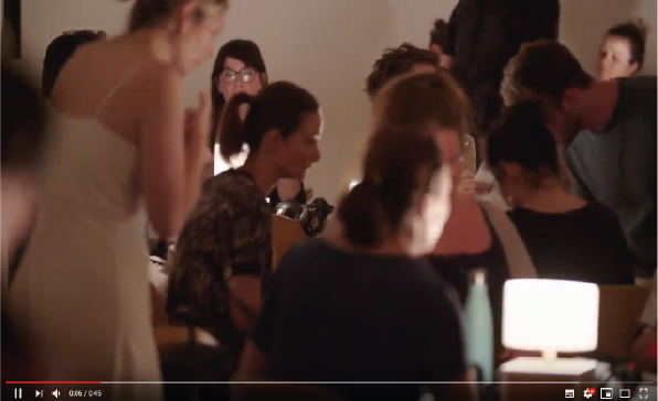 Video Thumbnail: people sitting at tables by dimmed light, looking at their phones.